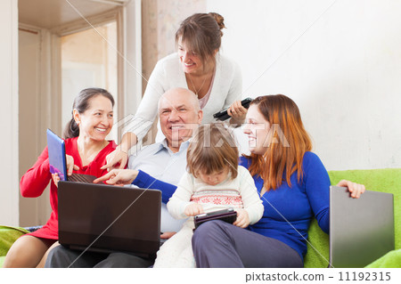 Happy family enjoys with few laptops 11192315