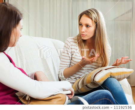 woman telling to friend about her problems 11192536