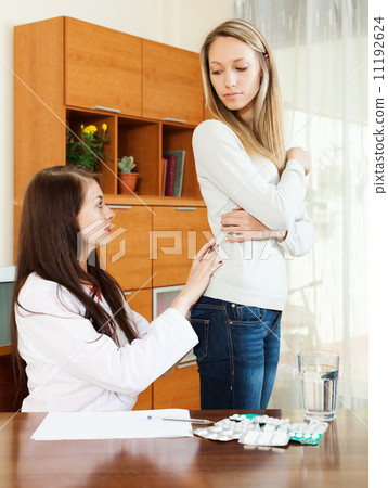 Doctor touching behind of patient Doctor touching behind of patient 11192624