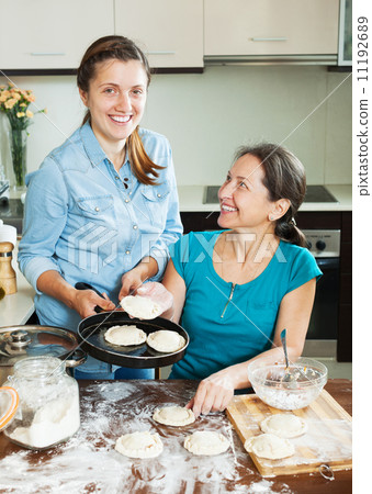 Happy women making pies 11192689