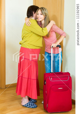 girl hugging mother at the door 11192965