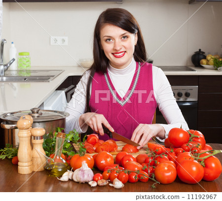 brunette woman slicing tomatoes 11192967