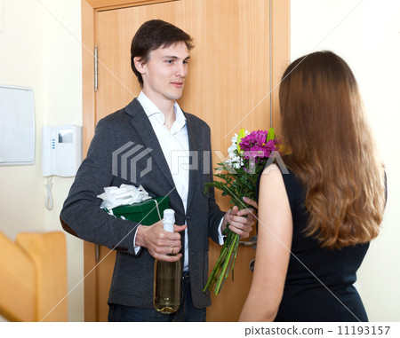 Young man giving gifts to woman Young man giving gifts to woman 11193157
