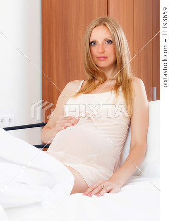 Sitting long-haired pregnancy woman Sitting long-haired pregnancy woman 11193659
