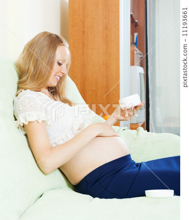 pregnancy woman caring for skin with cream pregnancy woman caring for skin with cream 11193661