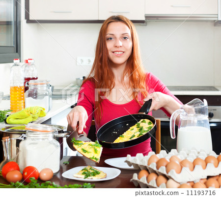 Woman with cooked omelet 11193716