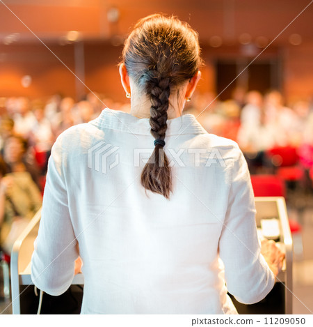 Female academic professor lecturing at the faculty. Female academic professor lecturing at the faculty. 11209050