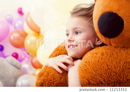 Portrait of sweet little girl hugging teddy bear 11213352