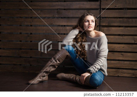 young woman in cowboy style clothes over wood young woman in cowboy style clothes over wood 11213357