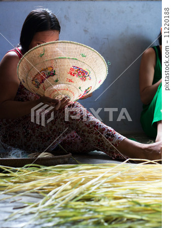 People making conical hat 11220188