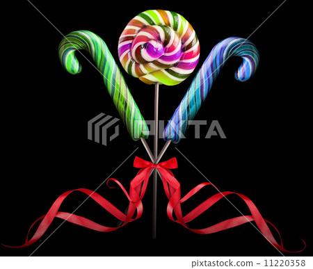 Bright colorful lollipop over black background Bright colorful lollipop over black background 11220358