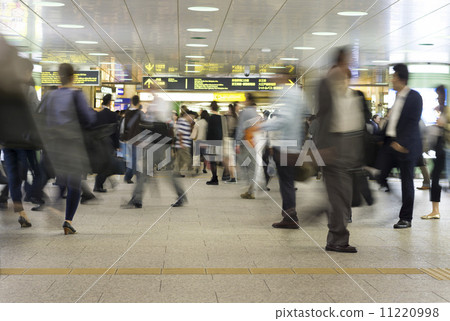 Various people image (slow shutter) to and from large crowded metropolitan stations 11220998