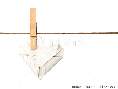 close up of Paper heart and clothespins attached to a rope close up of Paper heart and clothespins attached to a rope 11222595