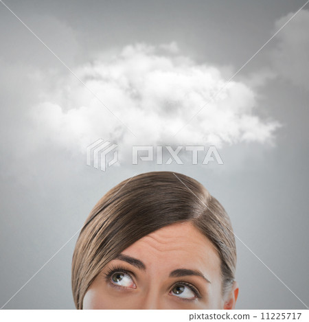 Close up of young woman looking up for thought bubble above her Close up of young woman looking up for thought bubble above her 11225717