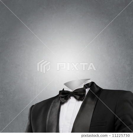 Man without head on dark concrete background 11225730