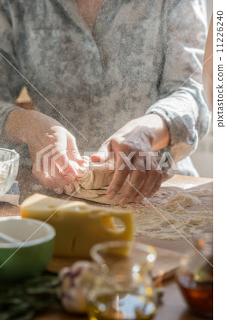 Woman cooking pizza Woman cooking pizza 11226240