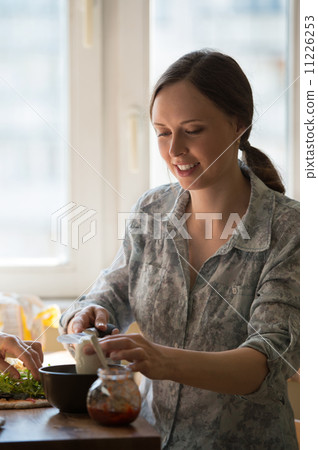 Woman cooking pizza Woman cooking pizza 11226253