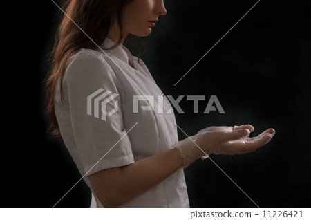 Female doctor holding something hands Female doctor holding something hands 11226421