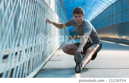 Man stretching Man stretching 11226554