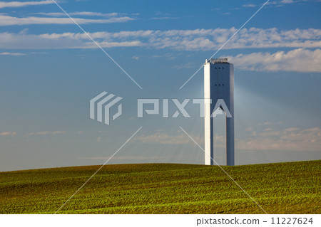 Solar Tower with rays - thermo-solar power - blue sky and green Solar Tower with rays - thermo-solar power - blue sky and green 11227624