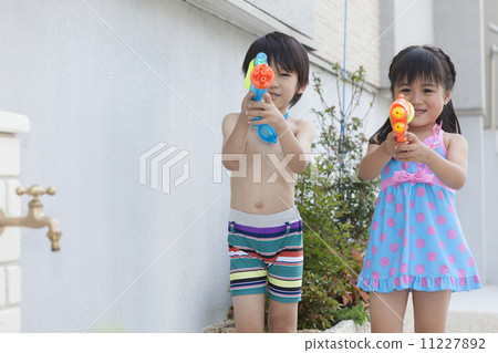 Boys and girls playing in the water 11227892