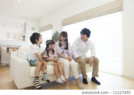 family sitting on the sofa family sitting on the sofa 11227895