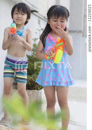 Boys and girls playing in the water Boys and girls playing in the water 11228025