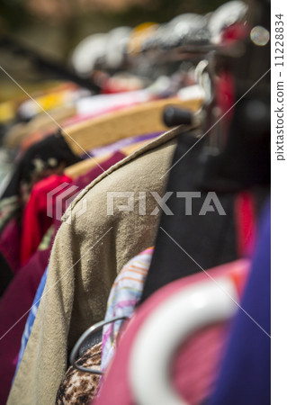 clothes on a rack on a flea market clothes on a rack on a flea market 11228834