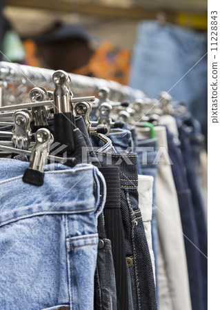 clothes on a rack on a flea market 11228843