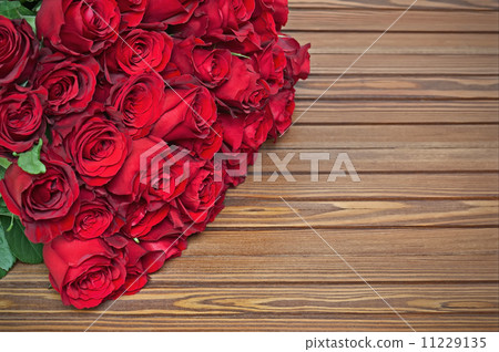 Colorful flower bouquet from red roses on wooden background. Colorful flower bouquet from red roses on wooden background. 11229135