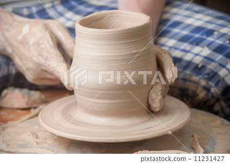 Hands of a potter Hands of a potter 11231427