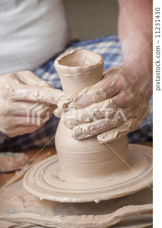 Hands of a potter Hands of a potter 11231430