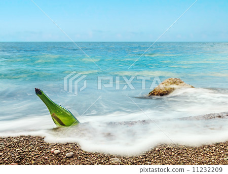 bottle with letter in sea water 11232209