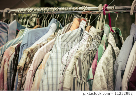 clothes on a rack on a flea market 11232992