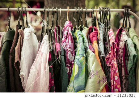 clothes on a rack on a flea market 11233025