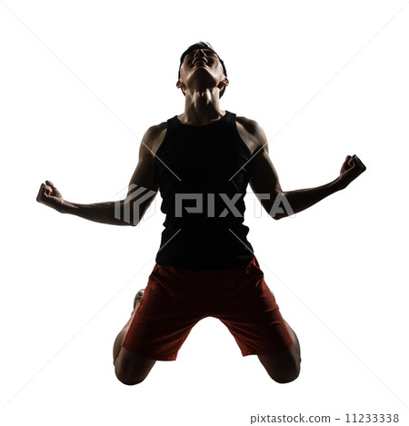 young athletic man kneeling 11233338