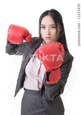 Business woman with boxing gloves 11233478