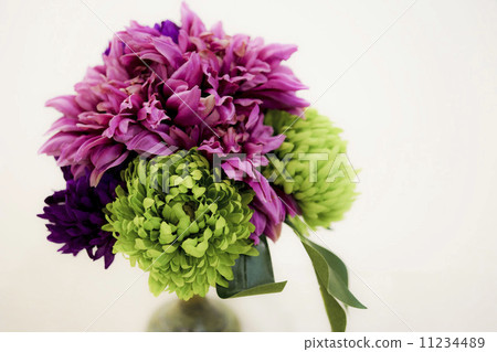 Green and pink artificial flowers 11234489