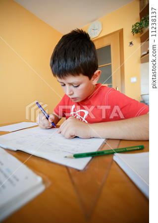 boy doing school homework 11238137