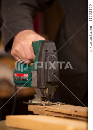 Elderly carpenter working in his workshop 11238399