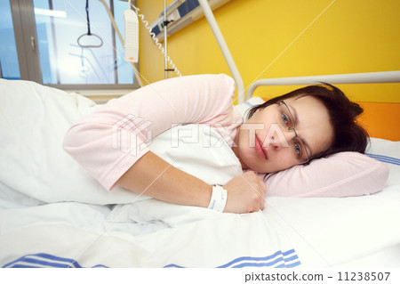 sad middle-aged woman lying in hospital 11238507