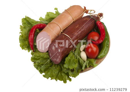 Sausage with vegetables on board 11239279