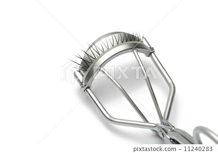 fake false eyelash with eyelash curler on white background  fake false eyelash with eyelash curler on white background  11240283