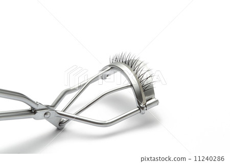 fake false eyelash with eyelash curler on white background fake false eyelash with eyelash curler on white background 11240286