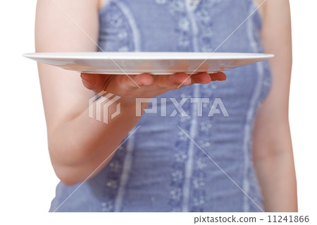 woman holds empty white plate on hand 11241866