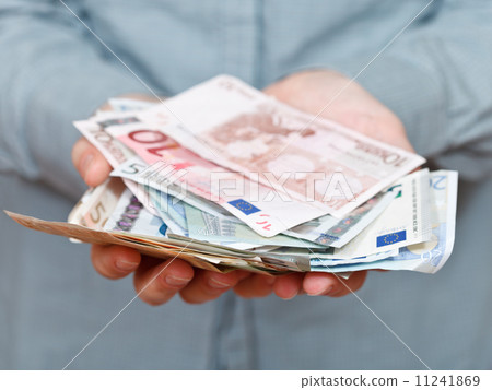 many euro banknotes in cupped palms many euro banknotes in cupped palms 11241869