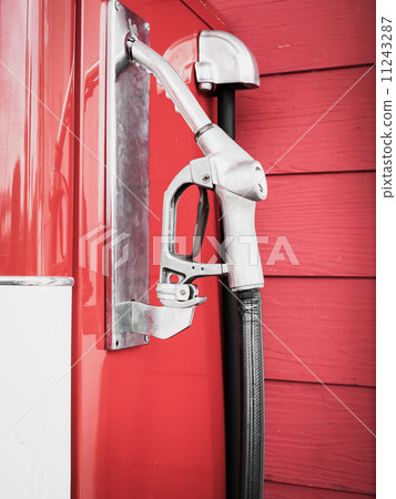 Gas pump nozzles in a service station 11243287