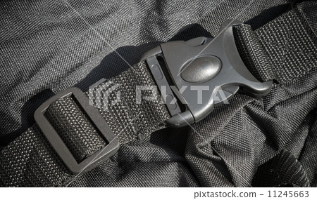 Closeup photo of a plastic catch on a sport bag 11245663