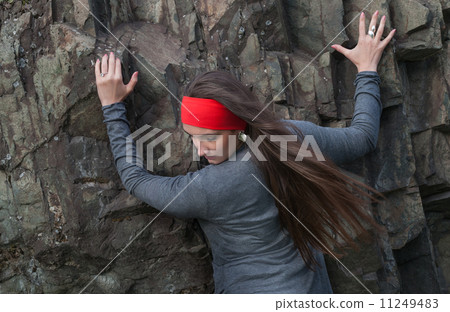 Beautiful young woman in red headband at the rock Beautiful young woman in red headband at the rock 11249483