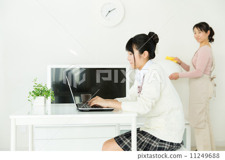 Teenage girls using a personal computer Teenage girls using a personal computer 11249688